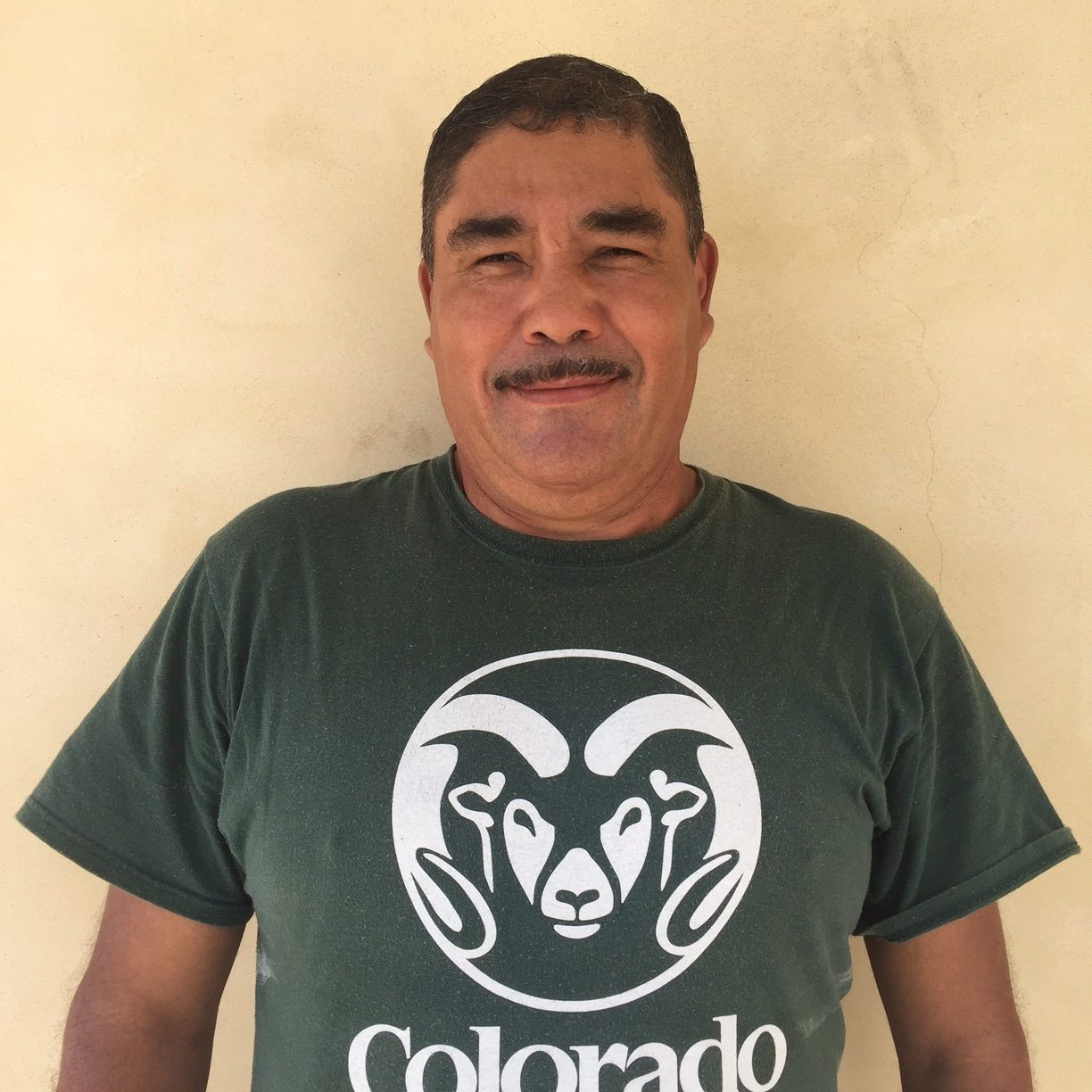 Man with a mustache and a CSU Rams t-shirt.
