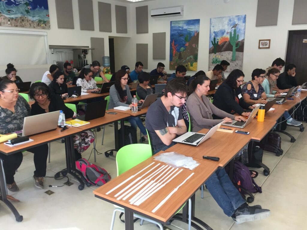 Students at desks in a classroom.